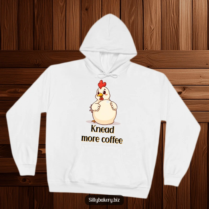 Funny chicken hoodie showcasing a determined cartoon chicken enthusiastically kneading a large ball of dough, a baker's intense focus.