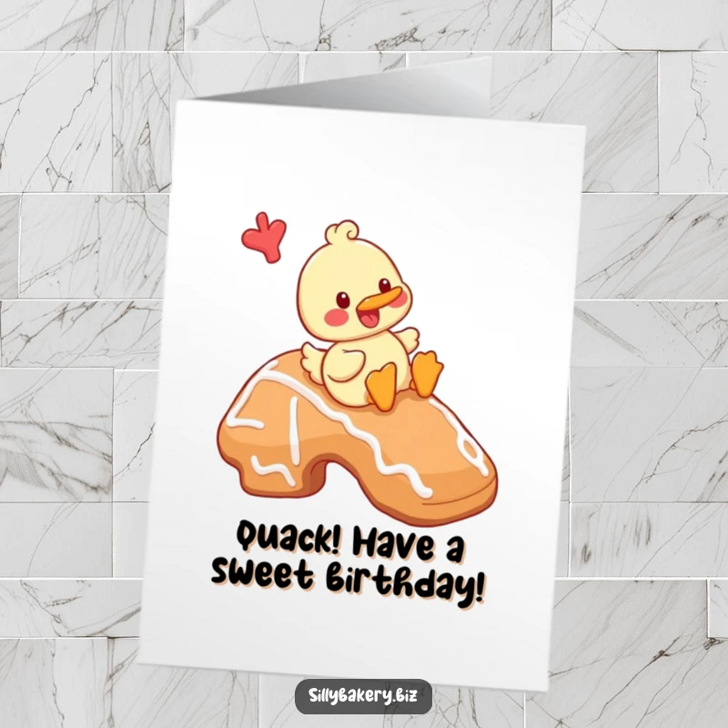 Funny Free Printable Birthday Card: A cheerful cartoon duck playfully slides down a giant gingerbread cookie.