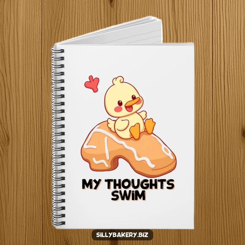 Funny duck notebook with a cheerful cartoon duck playfully sliding down a giant gingerbread cookie, a cheerful baking journal.