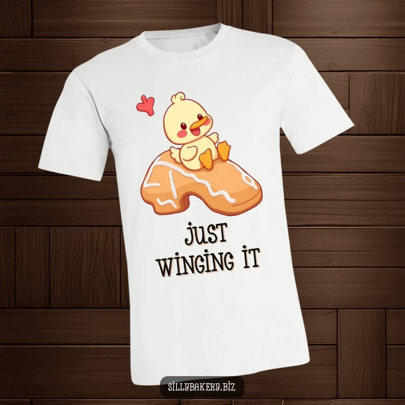 Funny duck t-shirt featuring a cheerful cartoon duck playfully sliding down a massive gingerbread cookie, a scene of sweet delight.